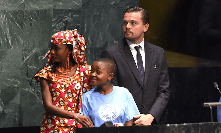 Hindou Oumarou Ibrahim with Getrude Clement, youth representative from Tanzania, and Leonardo DiCaprio at the signature ceremony for the Paris Agreement at the UN General Assembly Hall in New York (Photo: TIMOTHY A. CLARY/AFP/Getty Images) 
