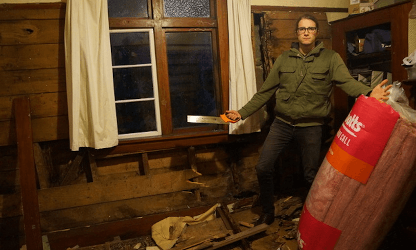 Tenant Leander Schulz at 47 London St, Dunedin, in 2012. The flat, named Dunedin’s worst in 2012 Otago University Students’ Association competition, is now transformed into a warm, low-energy villa thanks to the work of Schulz and his friends. Photo: supplied 
