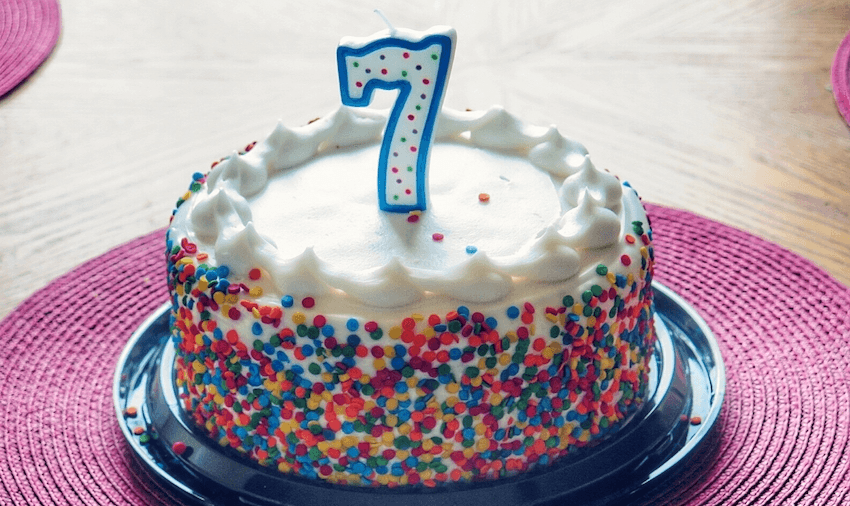 High Angle View Of Number 7 Candle On Birthday Cake