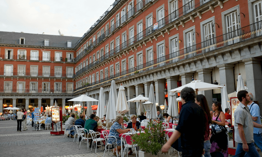 Tourists at a sidewalk cafe, Plaza Mayor, Madrid, Spain (Photo: Getty) 
