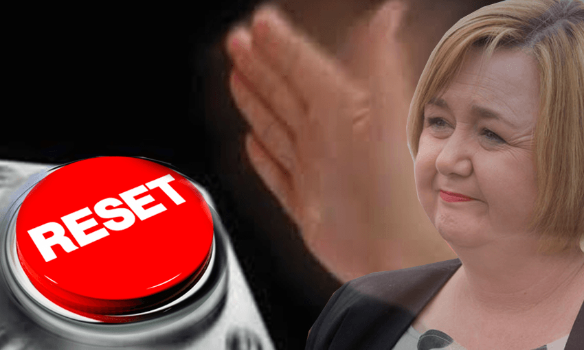 Artist’s impression of a disembodied hand alongside Megan Woods and a KiwiBuild reset button.  
