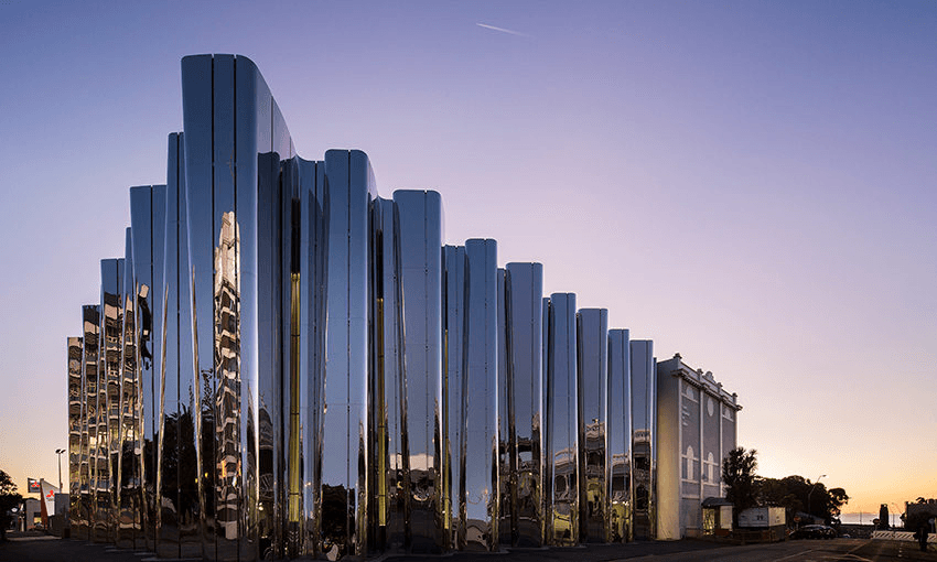 An image of the Govett-Brewster gallery in New Plymouth, Taranaki, against a blue-red sunset