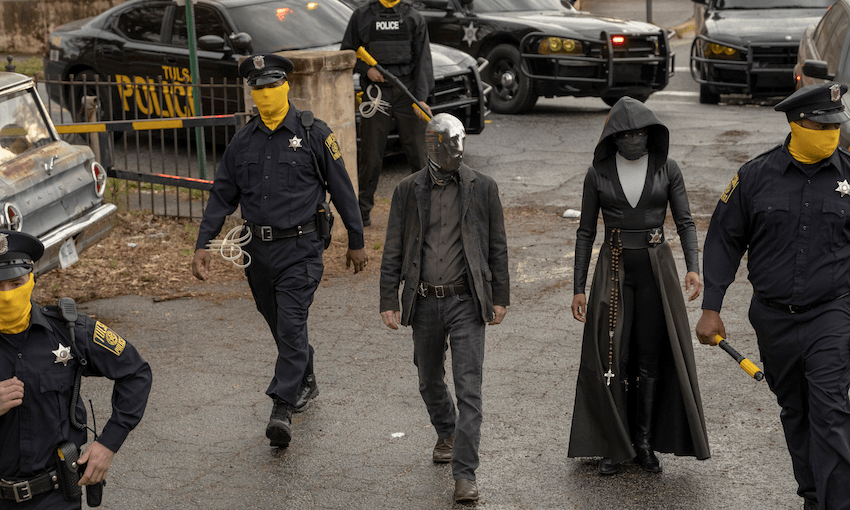 Tim Blake Nelson (middle) as Wade / Looking Glass and Regina King (right) as Det. Angela Abar / Sister Night in Watchmen. 
