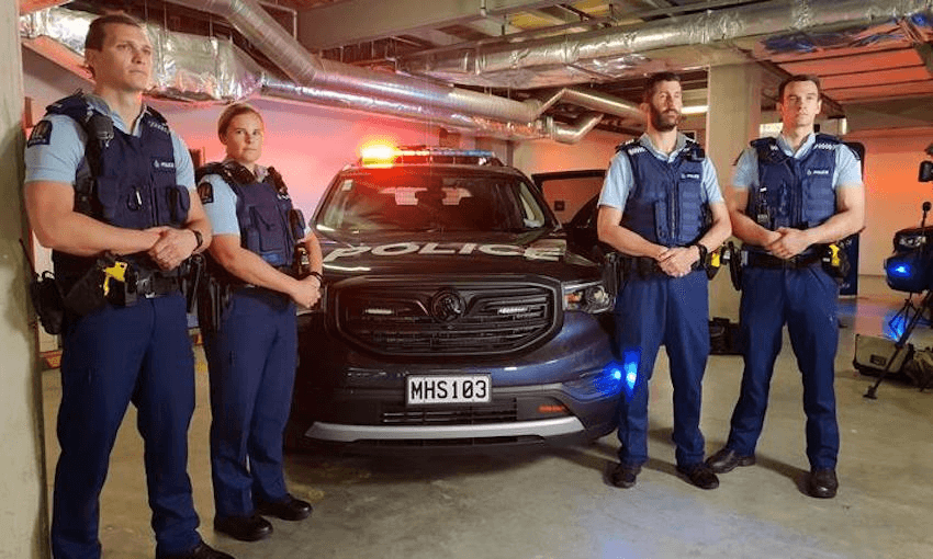 Police officers pose with the new special patrol vehicle that will soon be operating in Auckland, Waikato and Christchurch carrying armed officer that can respond quickly to incidents. Photo: RNZ / Liu Chen 

