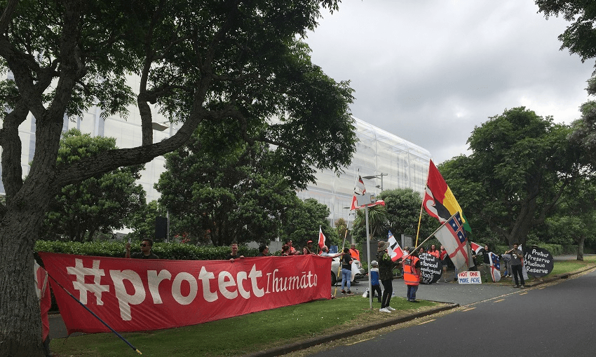 Ihumatao protesters demonstrate outside the Fletcher Building AGM at Eden Park. (Photo: Maria Slade.) 
