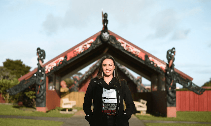 Ngāti Whātua artist and activist Hana Maihi outside Ōrākei marae at Takaparawhā, Tāmaki Makaurau. Photo: Nicole Hunt 
