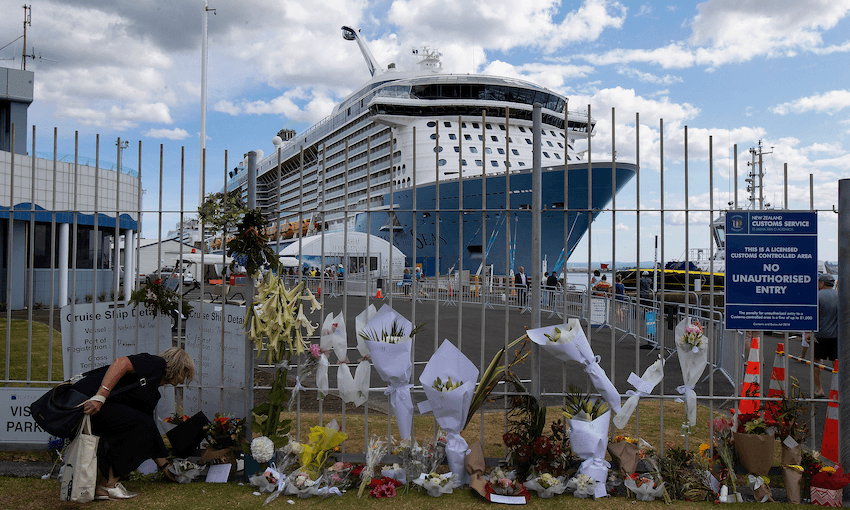 Tributes to the victims of Monday’s Whakaari/White Island eruption near the Port of Tauranga berth of cruise ship Ovation of the Seas, which carried passengers who travelled to the volcano when it erupted (Photo: John Boren/Getty Images) 
