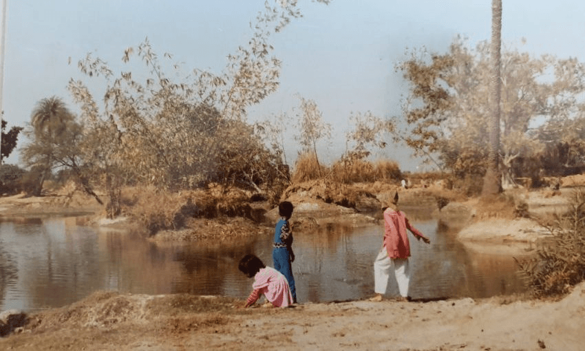 Children play by the pond alongside Anjum Rahman’s maternal family home in Uttar Pradesh. Photo: author supplied 
