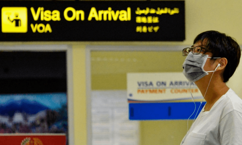 An airline passenger from China arriving at an airport in Indonesia (Getty Images) 
