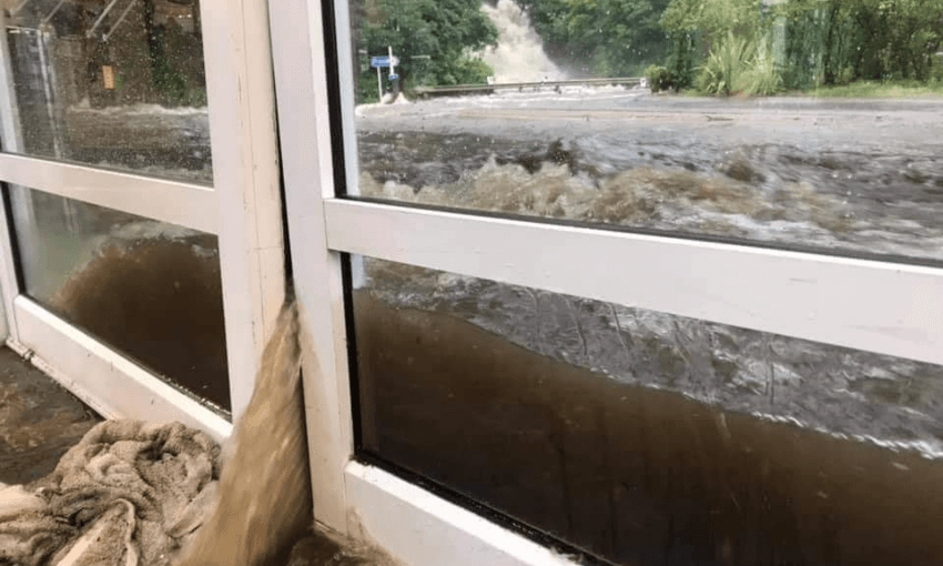 Flooding smashing into the Milford visitor terminal (via Facebook, Emergency Management Southland)