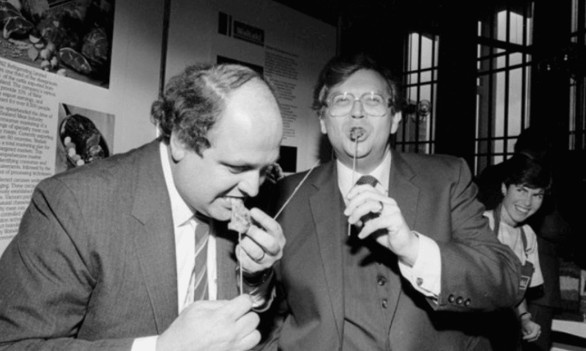 David Lange (right) and Mike Moore eating satay lamb kebabs in 1984 (Photo: John Nicholson for Evening Post via National Library) 
