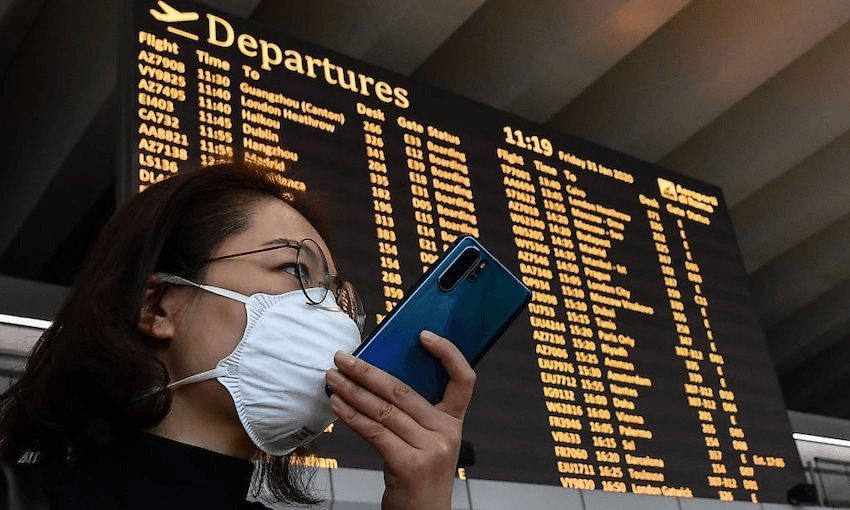 A passenger at Rome’s Fiumicino airport on January 31, 2020 (Photo by Tiziana FABI / AFP)  
