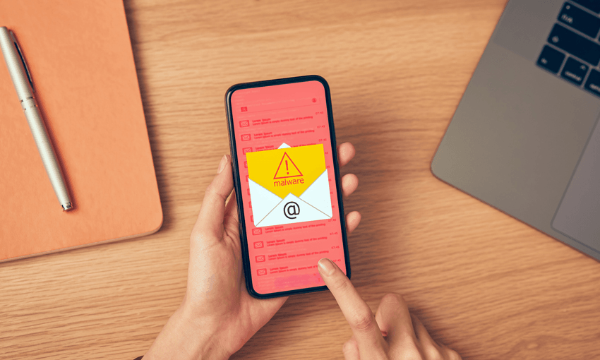 hand above a phone showing a safety alert