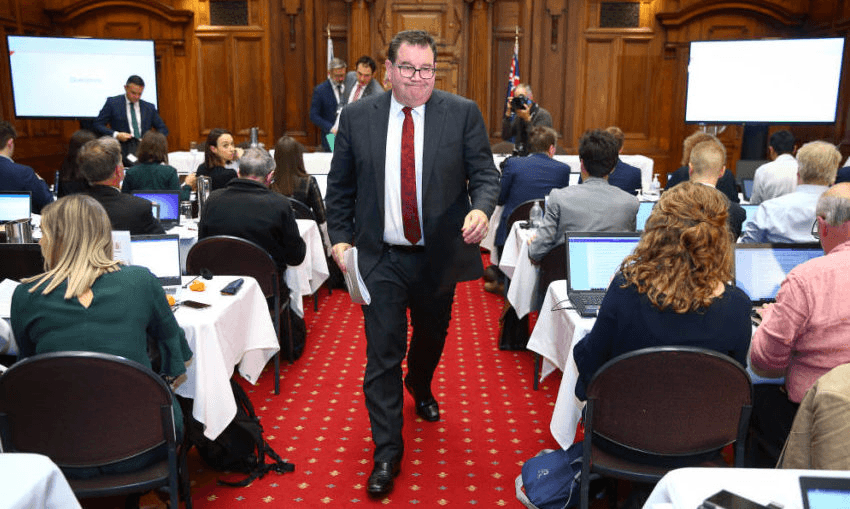 Finance minister Grant Robertson makes an exit at the conclusion of a Covid-19 financial response package announcement (Photo by Hagen Hopkins/Getty Images) 
