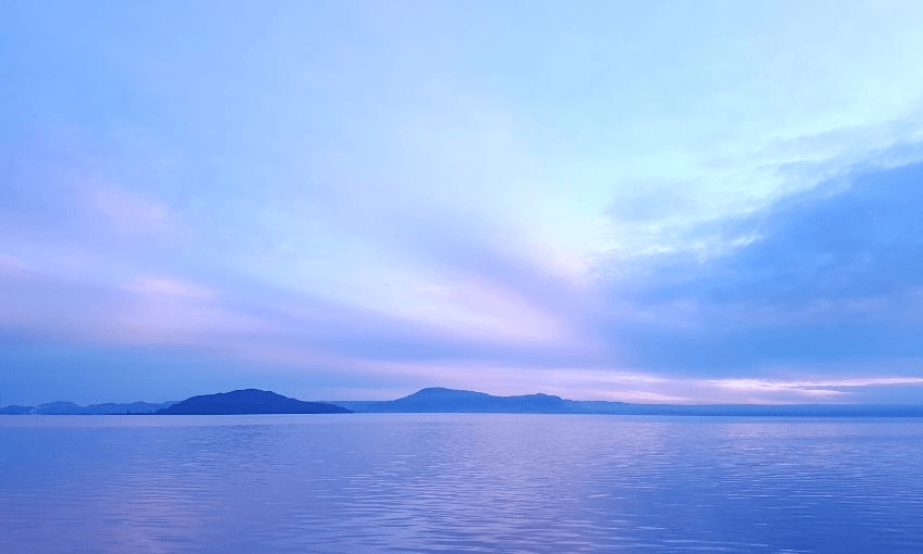 “We married… in the Māori Anglican Church of St Faith’s on the edge of Lake Rotorua. For a long time we lived by the lake, and watched the purple light of long evenings fall over the water…” Image: Kyal Thornton, iStock, via Getty 
