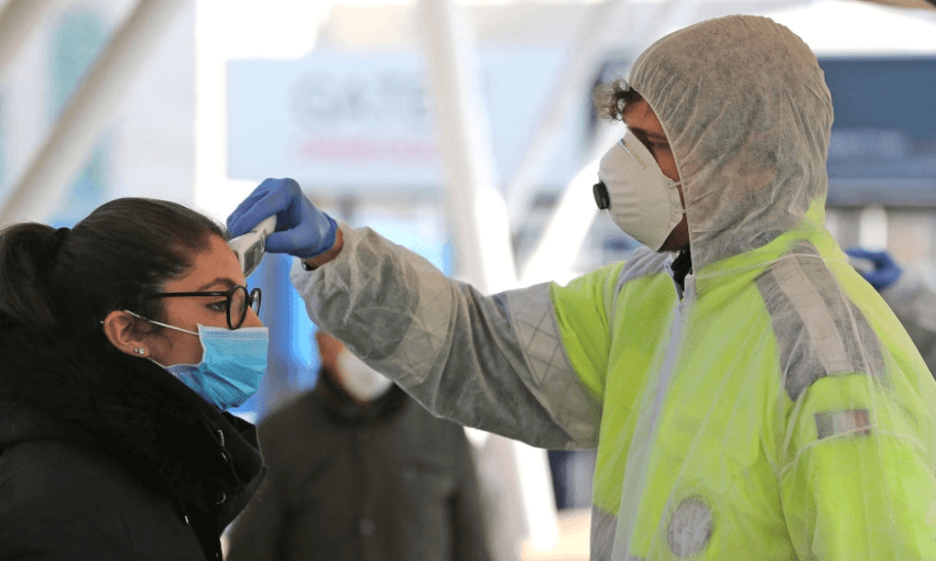 A tourist in Naples being checked with a thermal scanner, amid the Covid-19 outbreak (Getty Images) 
