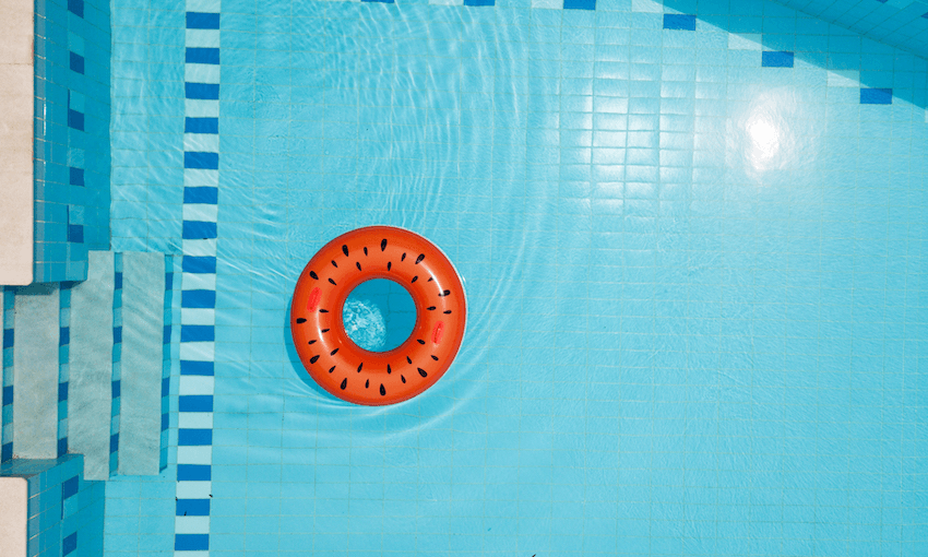 an empty pool with a plastic ring floating on it