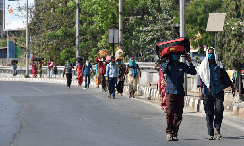 Out-of-work labourers are returning to their villages after the Indian government announced a nationwide lockdown on March 25 (Photo: Pramod Thakur/Hindustan Times/Getty Images) 
