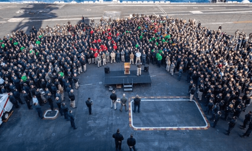 Brett Crozier, commanding officer of USS Theodore Roosevelt, addresses the crew in December last year. (Photo by U.S. Navy via Getty Images) 
