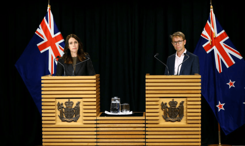 Jacinda Ardern and Health Ashley Bloomfield at a Beehive briefing in April 2020. (Photo by Hagen Hopkins/Getty Images) 
