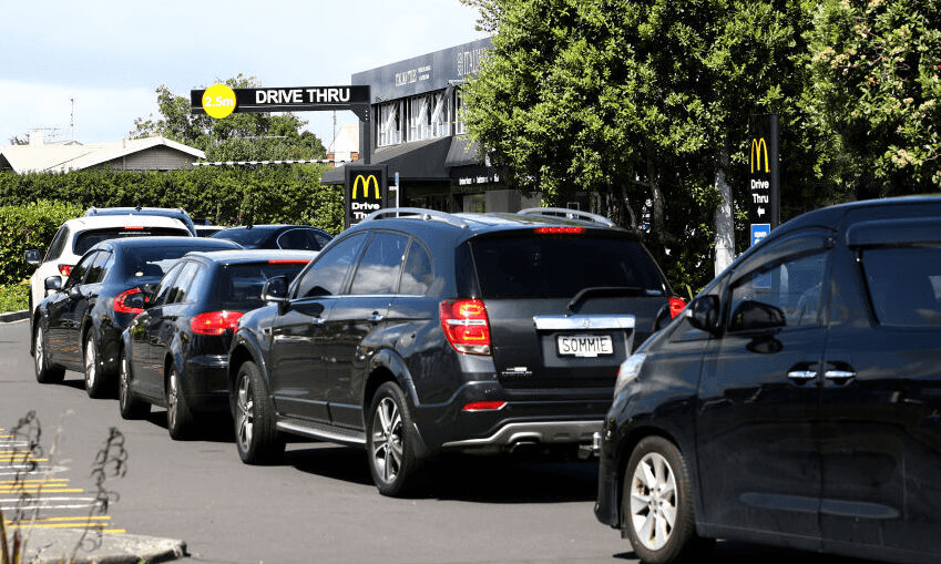 A drive-through queue in the hours before lockdown. (Photo by Phil Walter/Getty Images) 
