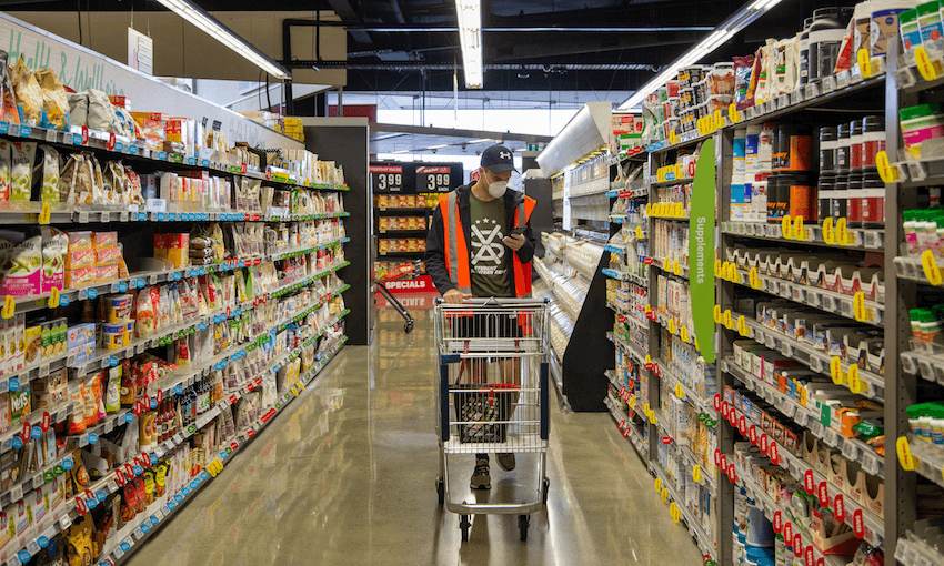 An SVA volunteer shops for groceries for someone in need. Photo: Supplied 
