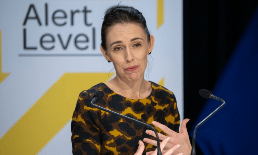 PM Jacinda Ardern outlining alert level rules at a press conference (Photo: Getty Images) 
