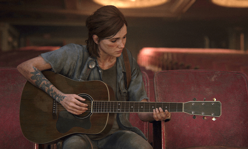 Ellie plays the guitar in a brief moment of respite in The Last of Us Part II. (Photo: SIIE) 
