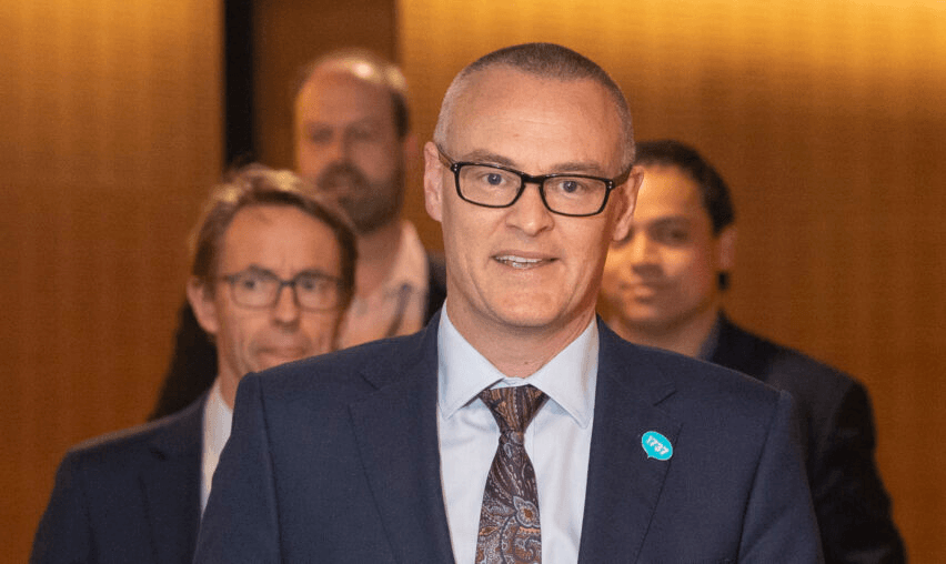 David Clark and Ashley Bloomfield on their way to a press conference. Photo by Mark Mitchell – Pool/Getty Images 
