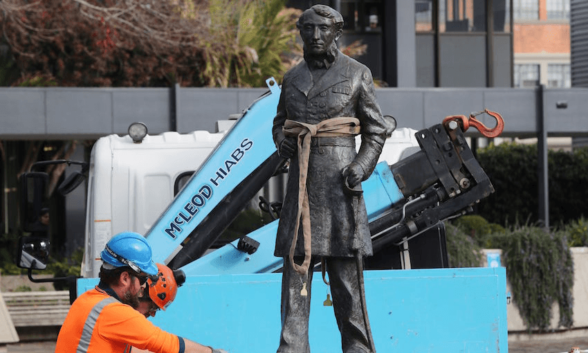 Workers remove the statue of Captain John Fane Charles Hamilton, June 12, 2020. (Photo: Michael Bradley / AFP)  
