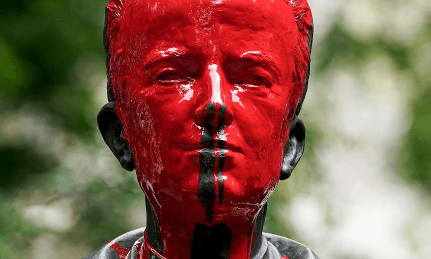 The vandalised statue of King Baudouin of Belgium (1930-1993) in front of Saint Michael and Gudula Cathedral, in the centre of Brussels, 12 June 2020 (Photo by KENZO TRIBOUILLARD/AFP via Getty Images) 
