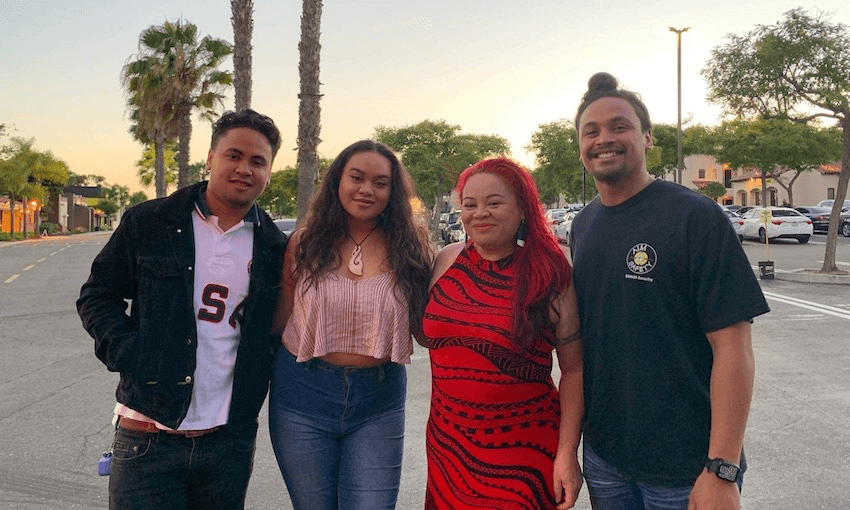 The author, in red, with her children Tūmanako, Tiararaina and Tāne.  
