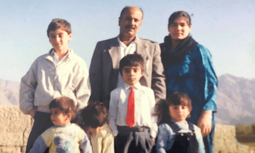 Kurdish New Zealander Kaz Eskerie, in the red tie, in a refugee camp in Pakistan, 1992 
