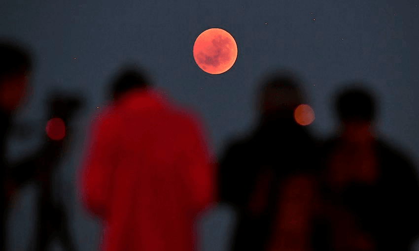 A blood moon over Melbourne, July 2018 (Photo: William West/AFP via Getty Images) 
