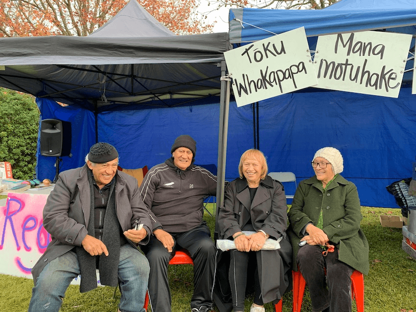 Kaumātua including Lena Huirama, second from right, supporting the protesters at Pukeiāhua Pā (Photo: Charlotte Muru-Lanning) 
