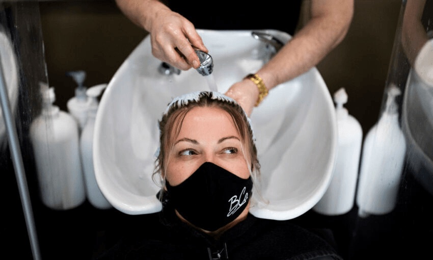 A customer (not Elle) has her hair washed at a salon in Marylebone, London.(Photo by Dan Kitwood/Getty Images) 
