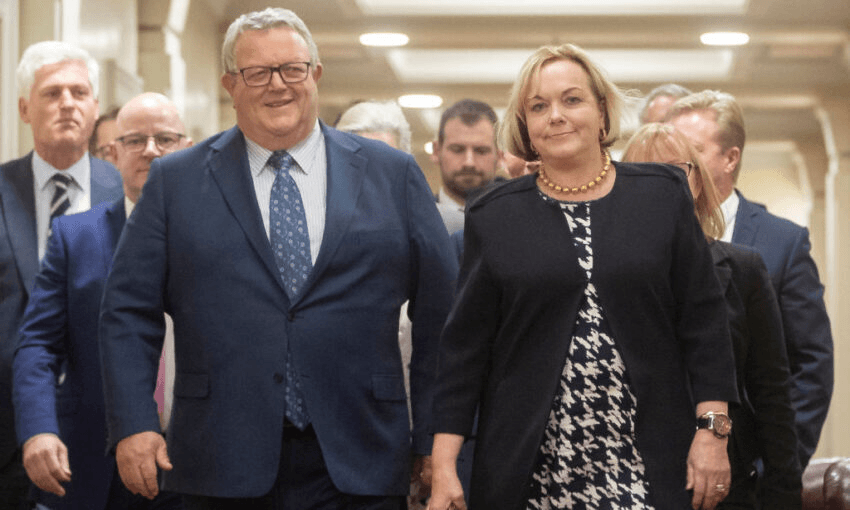 Judith Collins and Gerry Brownlee lead out the National caucus after their selections as leader and deputy, July 2020. (Photo: Robert Kitchin-Pool/Getty Images) 
