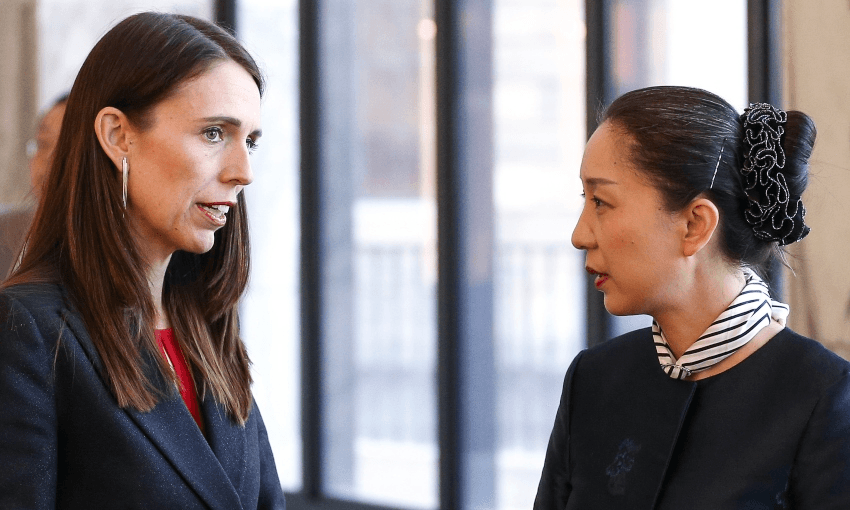 PM Jacinda Ardern and Chinese ambassador Wu Xi speaking at parliament during Chinese New Year celebrations in 2020 (Hagen Hopkins, Getty Images) 
