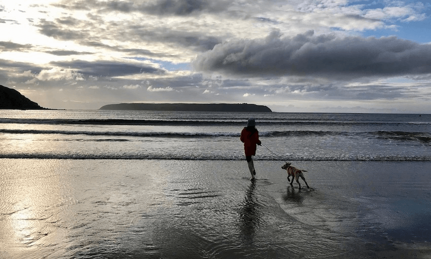 Piiata on the beach at Tītahi Bay with her girl (Photo: Supplied) 
