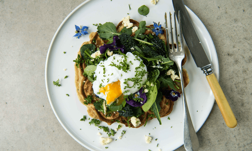 Cheese and onion sourdough waffles topped with some greens and a cheeky poached egg (Photo: Emma Boyd) 
