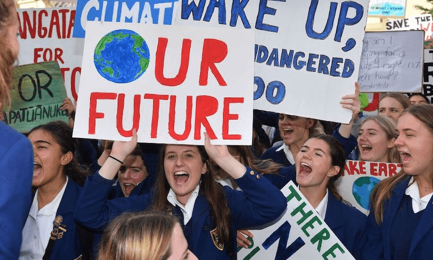 Students protest at Civic Square, Wellington, during the School Strike for Climate on March 15, 2019. (Photo: Marty MELVILLE / AFP via Getty Images) 
