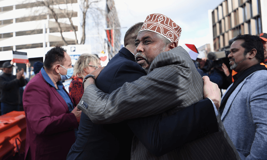 Mohamed Jama celebrates with members of the public outside Christchurch High Court. (Photo: Kai Schwoerer/Getty Images) 
