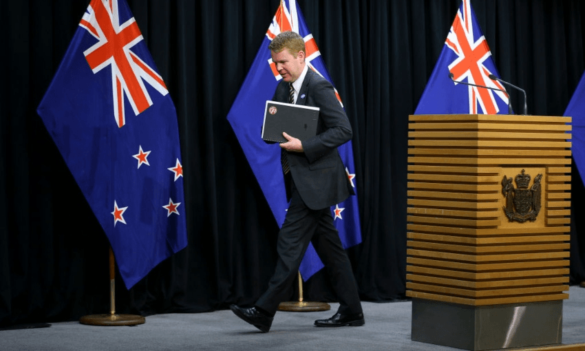 Health minister Chris Hipkins leaving a press conference at parliament (Getty Images)  
