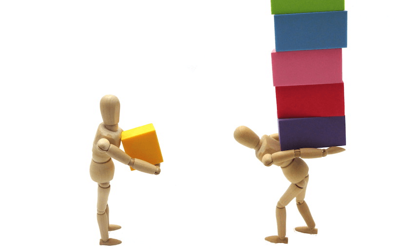 one figure holding small box, the other holding a stack of boxes. Unfair burden concept