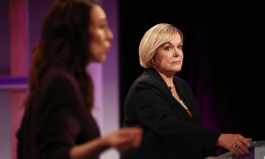 Judith Collins watches Jacinda Ardern during the first TV debate of the campaign (Getty Images) 
