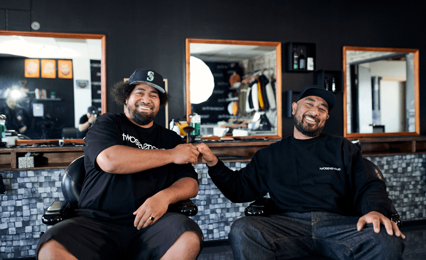 Barber Peleti Oli-Alainu’uese with ‘Fitz’ at the twosevenfive barbershop in Māngere. (Photo: Supplied) 
