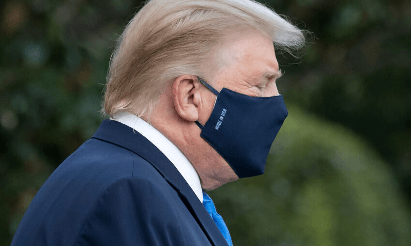 Donald Trump walks to Marine One before flying to Walter Reed Military Medical Center, after testing positive for Covid-19. Photo by SAUL LOEB/AFP via Getty Images 
