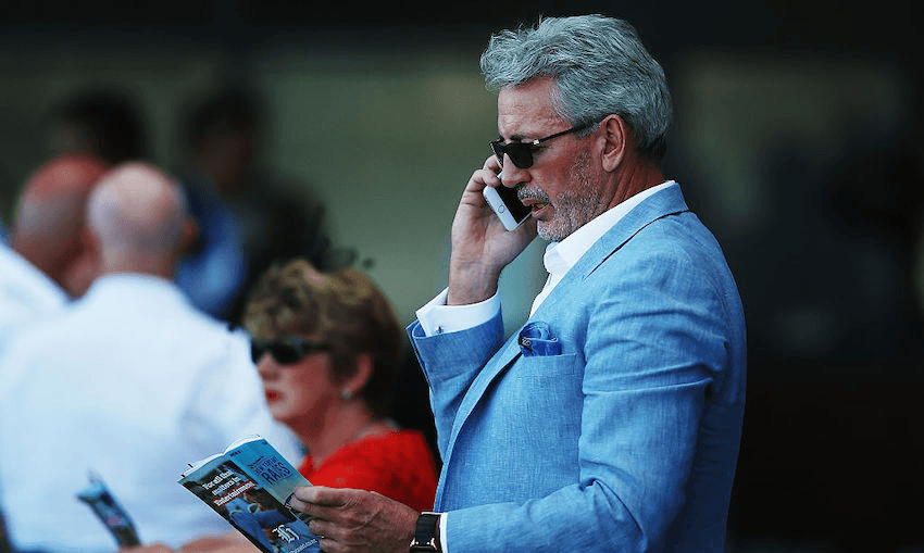 Eric Watson watches the New Year’s Day racing at Ellerslie Racecourse on January 1, 2015 in Auckland (Photo: Hannah Peters/Getty Images) 
