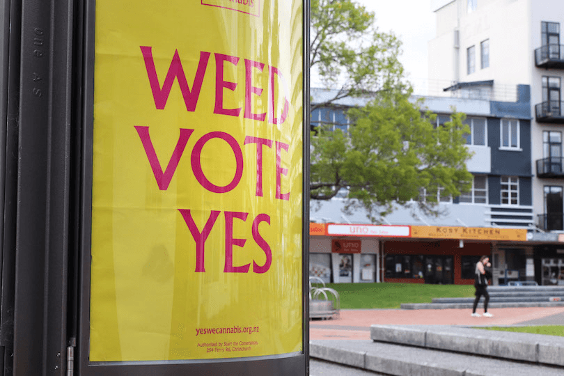 a yellow sign reading WEED VOTE YES