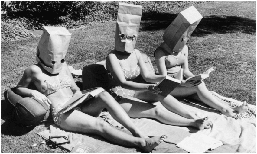 In 1963 these badasses wagged class to read Plato in the sun; the paper bags are so the teachers wouldn’t recognise them (Photo: Bettman via Getty) 
